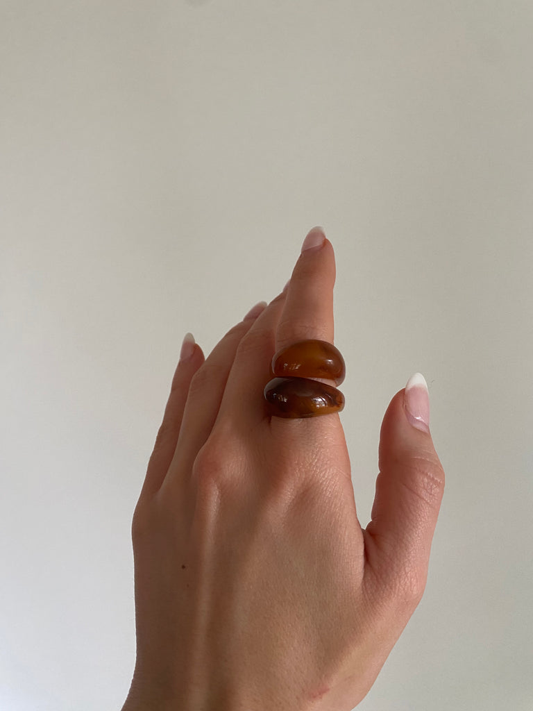 Close-up of a brown chunky ring featuring a statement-making, thick band.