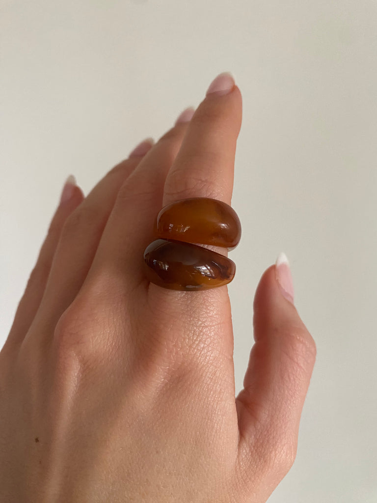 Trendy brown ring with a chunky, bold silhouette and sleek, modern finish.