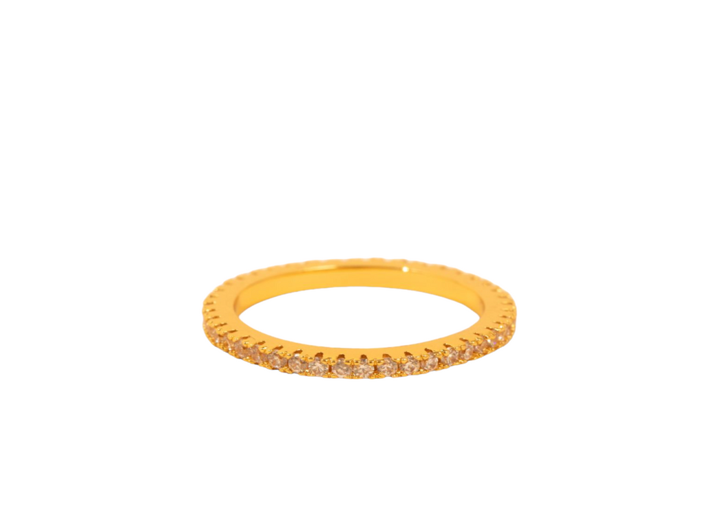 Elegant gold thin ring adorned with sparkling diamonds encircling the band for a touch of luxury.